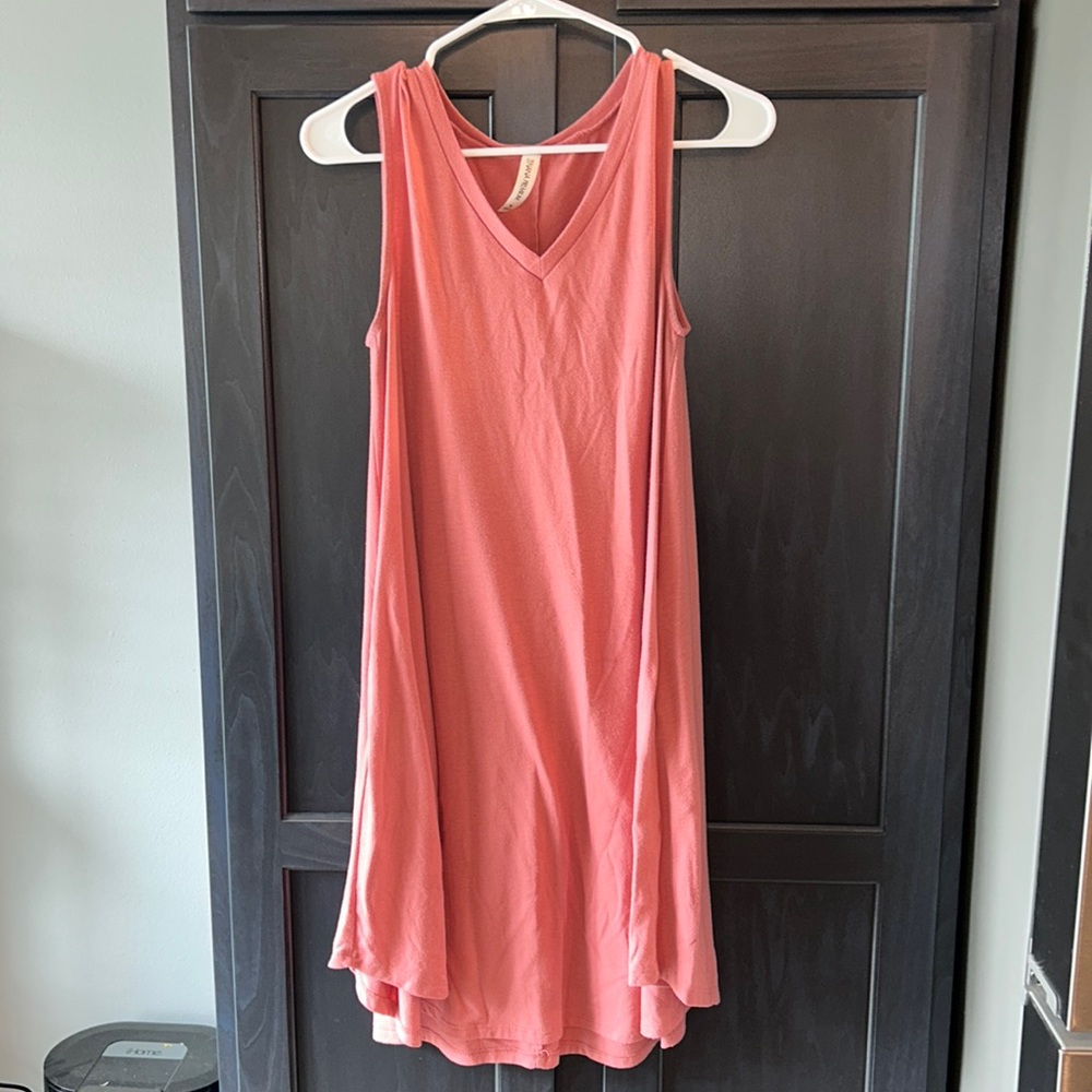 Women’s pink, a sleeveless dress size medium with pockets